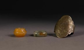 CHINESE CARVED GREY JADE RING (ring size O/P); a fawn JADE OJIME with flower head carved top and a