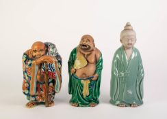 TWO JAPANESE PART-GLAZED FIGURES OF HOTEII, one wearing green robes and holding a fan (repaired),