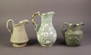 RIDGWAY OR AFTER, THREE RELIEF MOULDED AND PALE GREEN GLAZED POTTERY JUGS, one modelled in the ?