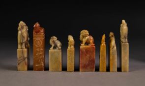 SIX CHINESE CARVED SOAPSTONE RECTANGULAR SEALS each with a Dog of Fo surmounting and two with man