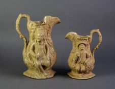 UNATTRIBUTED GRADUATED PAIR OF NINETEENTH CENTURY BUFF GLAZED RELIEF MOULDED POTTERY JUGS, moulded