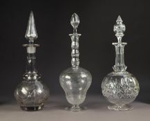 TWO ANTIQUE CUT GLASS DECANTERS WITH STOPPERS, together with an ETCHED EXAMPLE, 14 ½? (36.8cm)