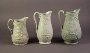 DUDSON OR ATTRIBUTED TO, THREE NINETEENTH CENTURY RELIEF MOULDED AND GREEN GLAZED POTTERY JUGS,