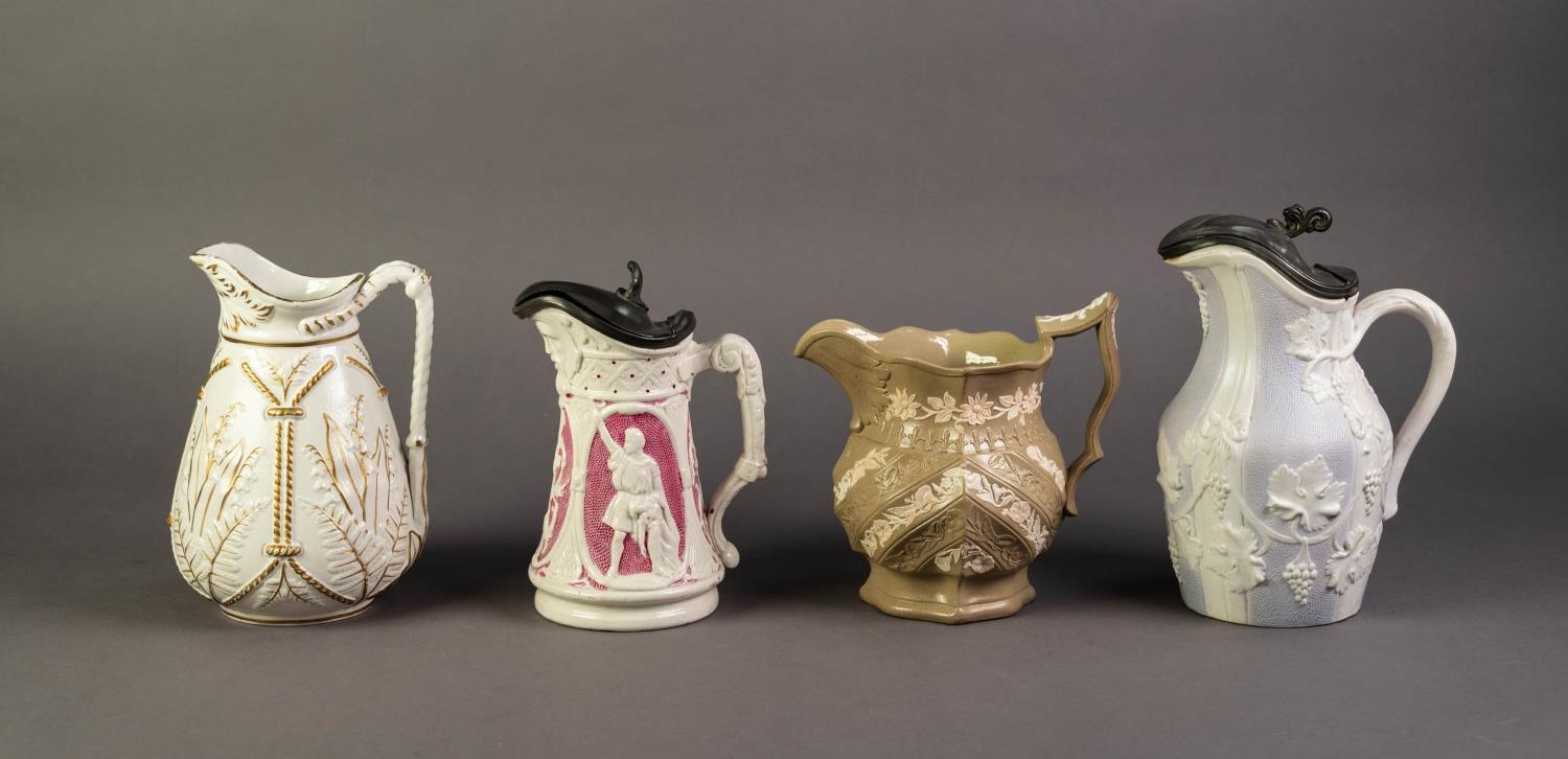 FOUR NINETEENTH CENTURY RELIEF MOULDED POTTERY JUGS, comprising: A LIDDED EXAMPLE IN PINK AND WHITE, - Image 2 of 2