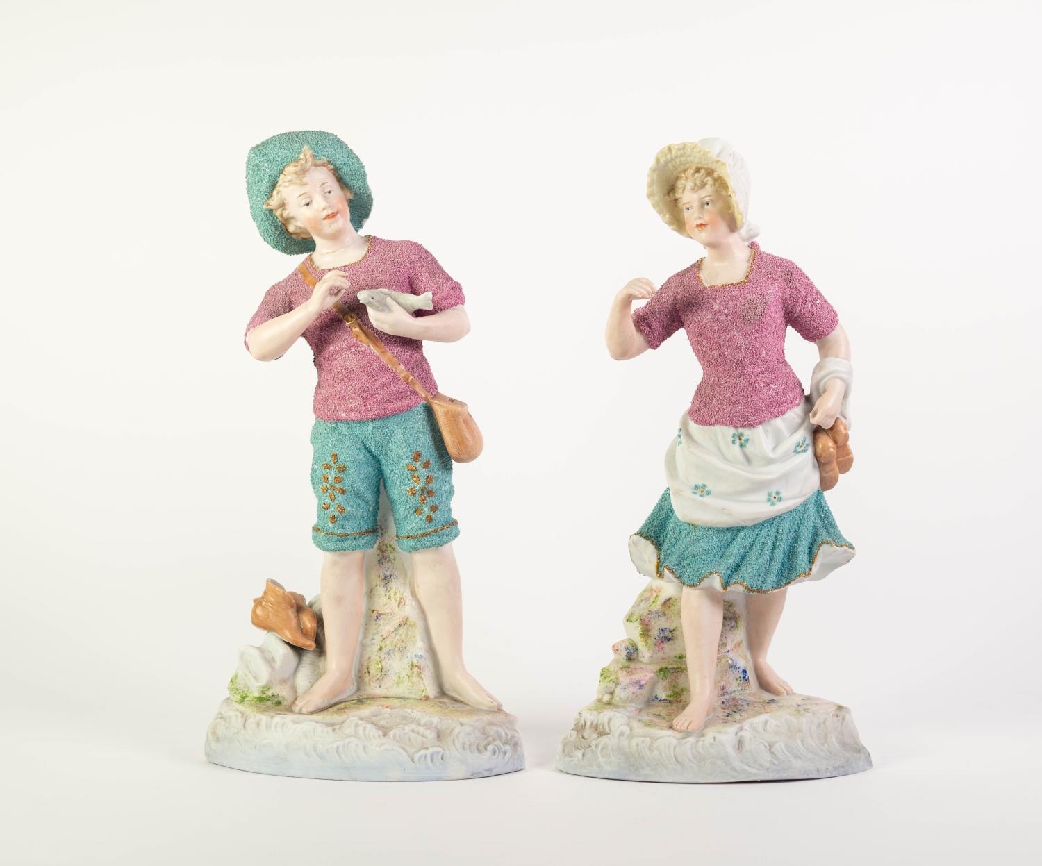 PAIR OF HEUBACH, GERMAN TINTED BISQUE FIGURE, painted in colours and gilt and modelled as a fisher