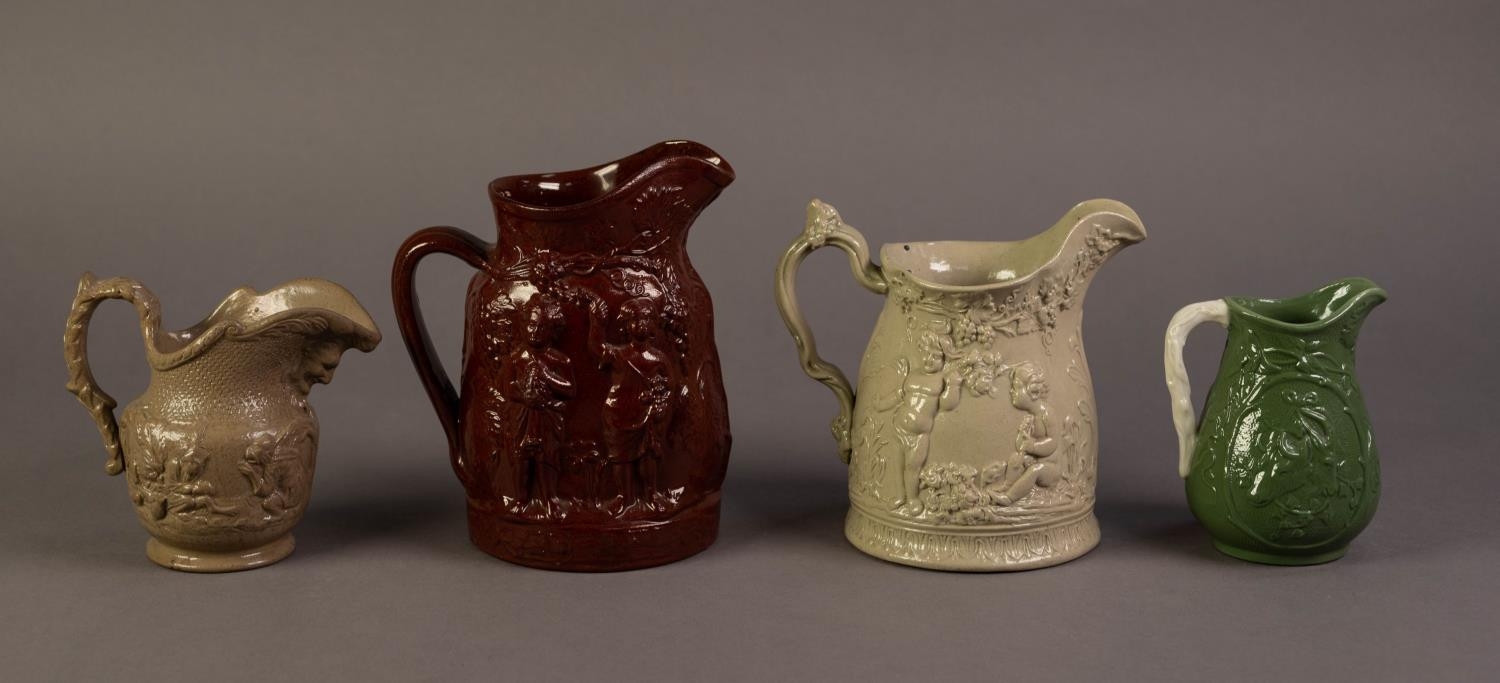 FOUR UNATTRIBUTED NINETEENTH CENTURY RELIEF MOULDED JUGS IN COLOURED GLAZES, comprising: ONE IN