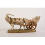 ROYAL DUX PORCELAIN RECEIVER GROUP OF A GOAT PULLING A CART, painted in muted tones and gilt, on a