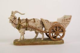 ROYAL DUX PORCELAIN RECEIVER GROUP OF A GOAT PULLING A CART, painted in muted tones and gilt, on a