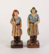 A PAIR OF LATE NINETEENTH CENTURY CONTINENTAL MAJOLICA FIGURES OF FISHERMEN, each carrying caught