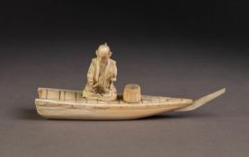 CHINESE EARLY 20th CENTURY CARVED IVORY FIGURE OF A FISHERMAN seated on the deck of a small boat