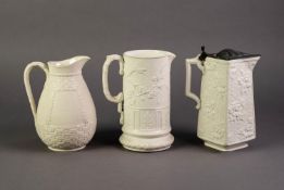 WILLIAM BROWNFIELD OR ATTRIBUTED TO, THREE NINETEENTH CENTURY RELIEF MOULDED POTTERY JUGS GLAZED