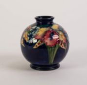 WILLIAM MOORCROFT TUBE LINED ?FRILLED AND SLIPPER ORCHID? POTTERY VASES, of footed, orbicular