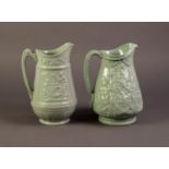 DUDSON OR ATTRIBUTED TO, TWO NINETEENTH CENTURY RELIEF MOULDED AND GREEN GLAZED POTTERY JUGS, one