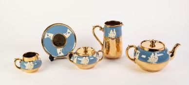 FOUR PIECE GIBSONS POTTERY TEASET, each piece sprigged in white on a blue border, and with gilt