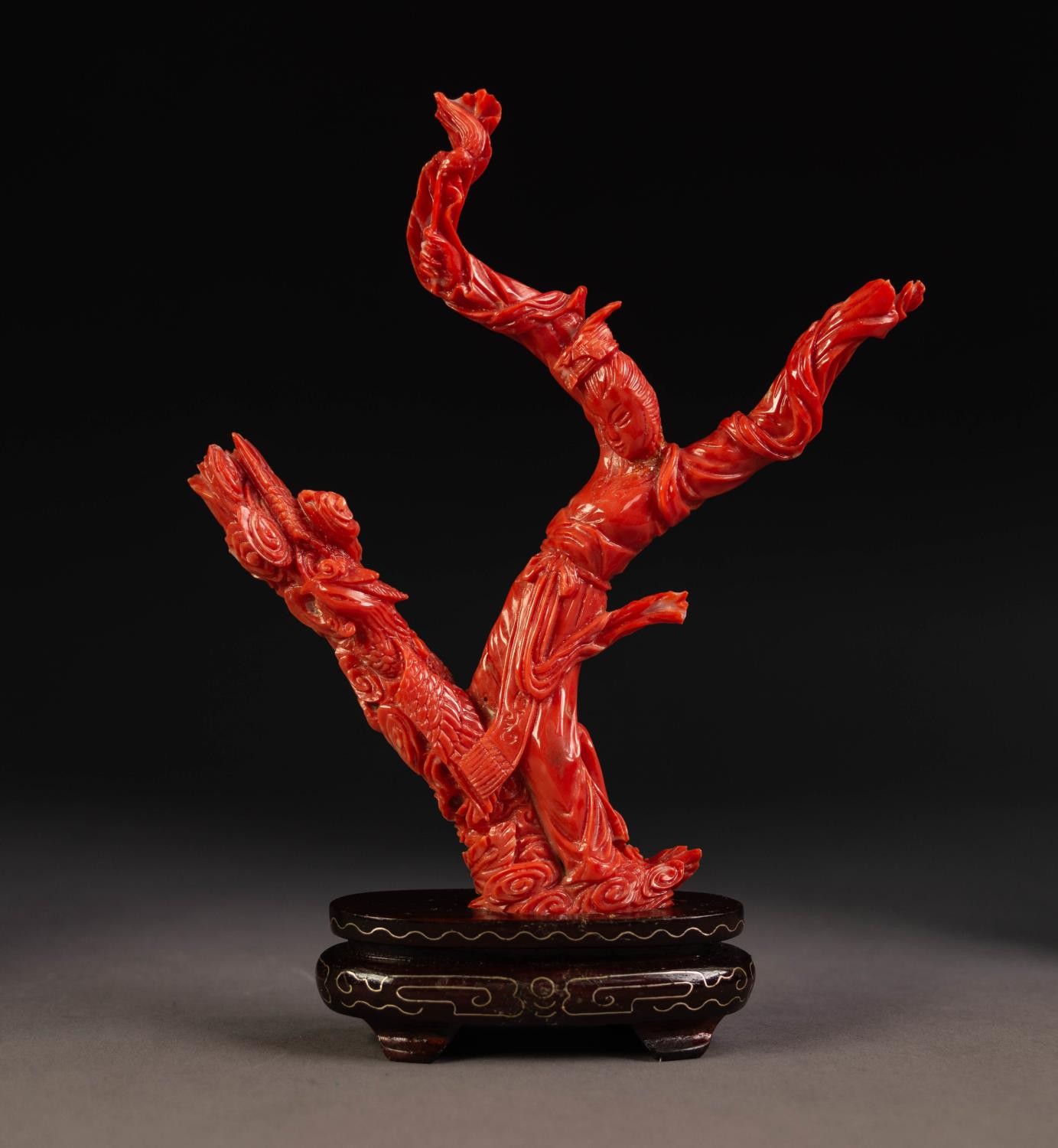 ORIENTAL CARVED RED CORAL DEPICTING A FEMALE FIGURE in flowing robes and a phoenix flying amidst