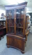 GEORGIAN STYLE MAHOGANY DOUBLE CORNER CUPBOARD WITH CONCAVE FRONT, MOULDED AND DENTIL CORNICE, THE