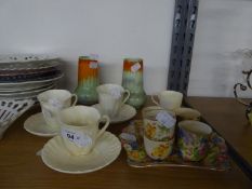 A SET OF THREE SHELLEY WHITE CHINA COFFEE CUPS, 3 SAUCERS, A PAIR OF SHELLEY GREEN AND ORANGE