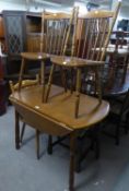 A SET OF THREE HARDWOOD SINGLE CHAIRS AND A FALL-LEAF CIRCULAR DINING TABLE