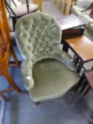 A LADY?S VICTORIAN SPOON BACKED LOW SEATED BOUDOIR EASY ARMCHAIR, BUTTON UPHOLSTERED IN GREEN