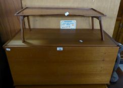 A SMALL TEAK STORE CUPBOARD, A MAHOGANY FOLD-FLAT TRAY TABLE (2)