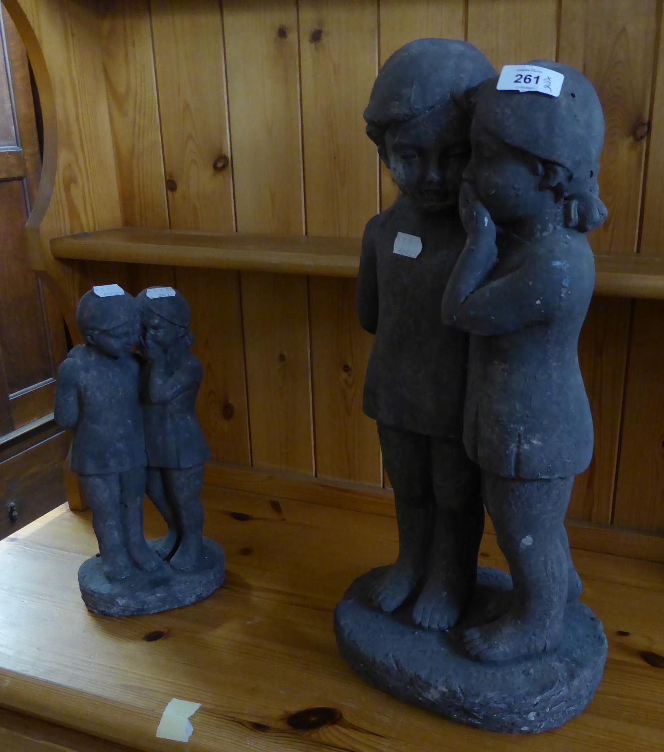 STONE GARDEN ORNAMENT OF TWO CHILDREN AND A SIMILAR SMALL ONE (2)