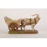 ROYAL DUX PORCELAIN RECEIVER GROUP OF A GOAT PULLING A CART, painted in muted tones and gilt, on a