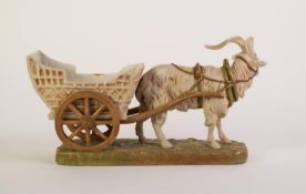 ROYAL DUX PORCELAIN RECEIVER GROUP OF A GOAT PULLING A CART, painted in muted tones and gilt, on a