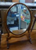 CIRCA 1920's GEORGIAN STYLE CHEVAL TOILET MIRROR, HAVING OVAL BEVEL EDGE MIRROR PLATE, THE FRAME