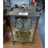 KUNDO ANNIVERSARY CLOCK IN GILT BRASS AND GLASS SQUARE CASE