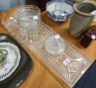 A CUT GLASS PEDESTAL DEEP BOWL (A.F.)  5 ¾? DIAMETER; TWO CUT GLASS DRESSING TABLE TRAYS; A POWDER