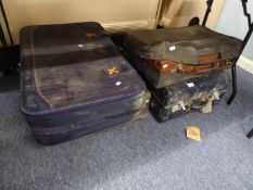 A VINTAGE BLACK FABRIC TRUNK AND OTHER SUITCASES