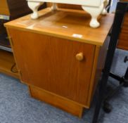 A TEAK RECORD CABINET WITH SINGLE DOOR, ON PLINTH BASE