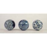 THREE EARLY 20th CENTURY BLUE AND WHITE CERAMIC SPHERICAL BALLS/STRESS BALLS, varying patterns,