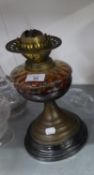 A VICTORIAN OIL TABLE LAMP, WITH AMBER GLASS RESERVOIR AND FUNNEL