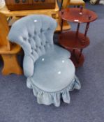 A MAHOGANY OFFICE CIRCULAR THREE TIER WHAT-NOT AND A BOUDOIR BUTTONED BACK EASY CHAIR, ON TURNED