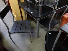 A MODERN BLACK ASH REPRODUCTION DINING TABLE, ON FOUR TUBULAR METAL LEGS AND WITH WIRE PATTERN