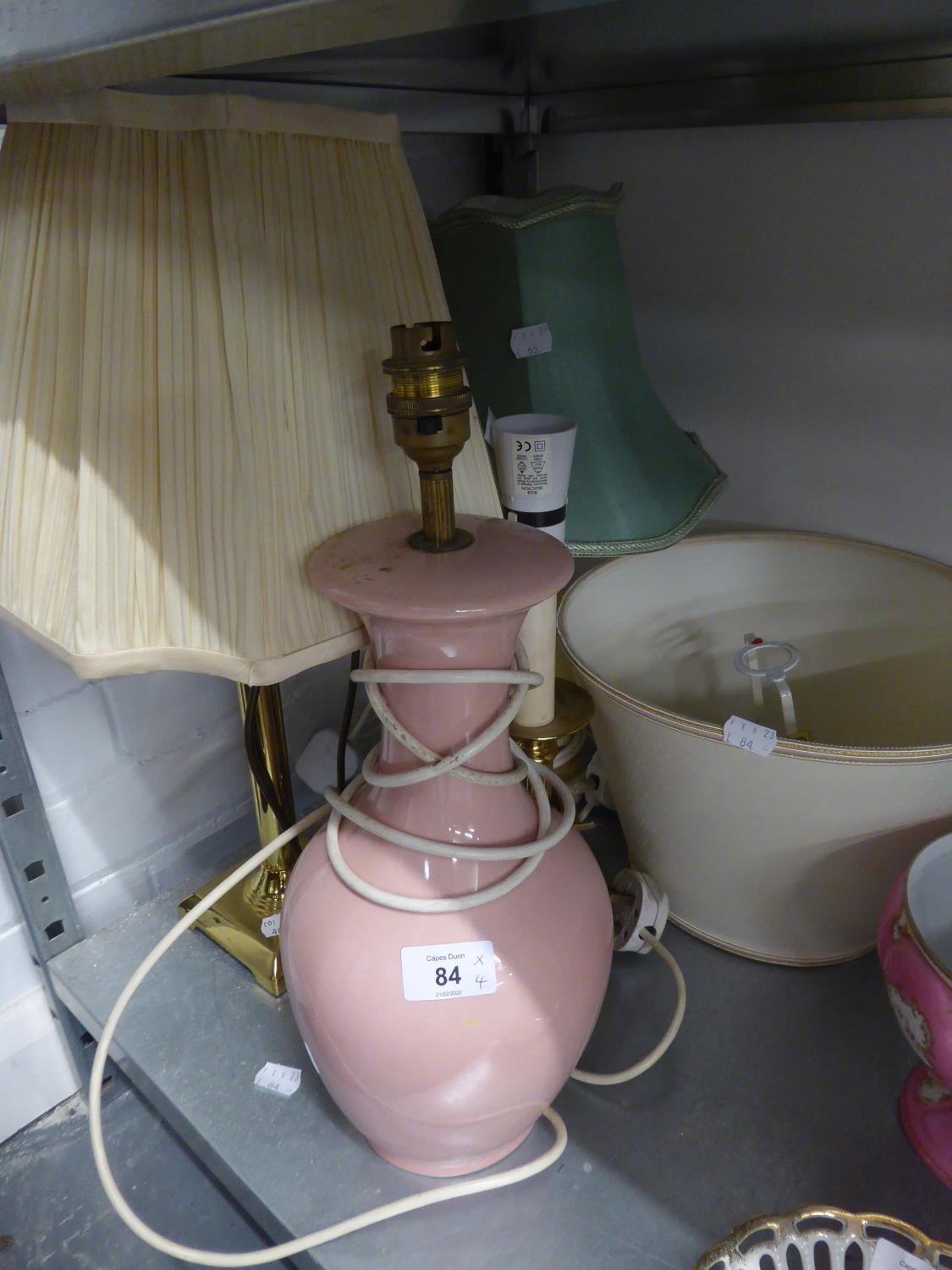 AN ALABASTER VASE TABLE LAMP AND SHADE, A LARGE PINK POTTERY VASE TABLE LAMP AND SHADE AND TWO BRASS