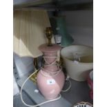 AN ALABASTER VASE TABLE LAMP AND SHADE, A LARGE PINK POTTERY VASE TABLE LAMP AND SHADE AND TWO BRASS