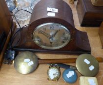 CIRCA 1920's OAK CASED NAPOLEONS HAT SHAPE MANTEL CLOCK, THE MOVEMENT STRIKING ON FIVE BARS.