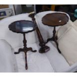 A PAIR OF GEORGIAN STYLE MAHOGANY CIRCULAR WINE TABLES, WITH WAVY STEPPED AND MOULDED BORDERS,