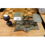 A POSTAL BALANCE SCALE, ON METAL OBLONG BASE, AND A DESK SEAL, LETTER ?B?, WITH WOODEN HANDLE