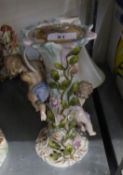 CONTINENTAL CHINA TABLE LAMP, WITH CHERUB FIGURE AND FABRIC SHADE (A.F.)