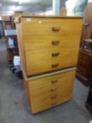 A PAIR OF TEAK CHESTS OF FOUR LONG DRAWERS, EACH WITH A SINGLE WOOD HANDLE, EACH 2?9? WIDE