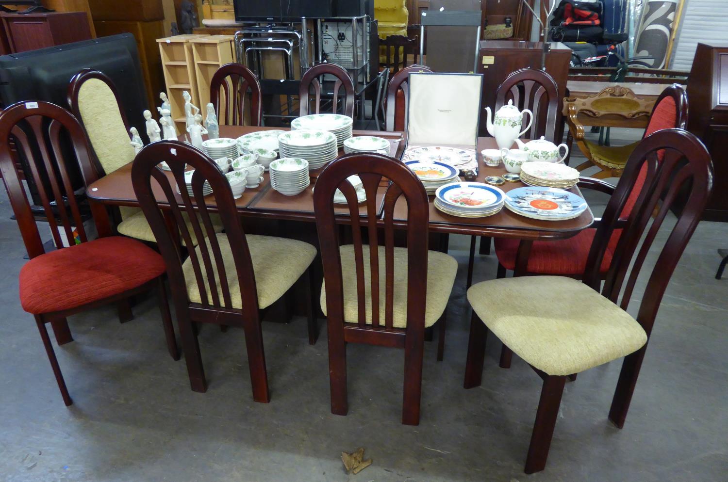 A REPRODUCTION MAHOGANY EXTENDING DINING TABLE,  WITH TWO EXTRA LEAVES AND A SET OF 10 MATCHING