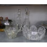 A HEAVY CUT GLASS FRUIT BOWL, CUT GLASS WATER JUG, A PAIR OF TALL GLASS CANDLESTICKS, A CUT GLASS