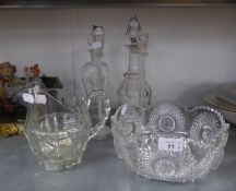 A HEAVY CUT GLASS FRUIT BOWL, CUT GLASS WATER JUG, A PAIR OF TALL GLASS CANDLESTICKS, A CUT GLASS