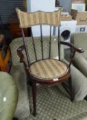 A HARDWOOD OPEN ARMCHAIR, SHAPED AND PADDED SHOULDER BOARD OVER  THREE LONG SPINDLES, CIRCULAR PAD