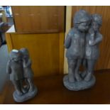 TWO RECONSTITUTED STONE GARDEN ORNAMENTS, EACH OF TWO NUDE CHILDREN