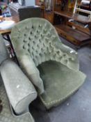 VICTORIAN SPOON BACKED EASY ARMCHAIR, UPHOLSTERED AND COVERED IN GREEN VELVET, ON TURNED AND LOBED