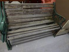 CAST IRON GREEN TWO SEATER GARDEN BENCH AND THE TWO MATCHING ARMCHAIRS (A.F.)